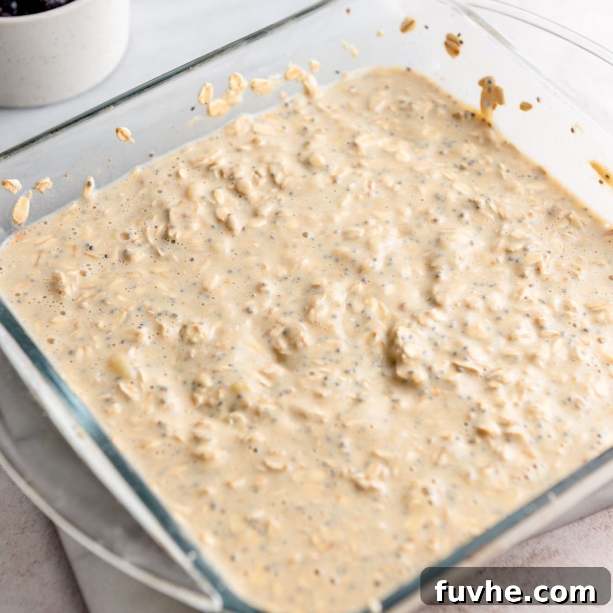 Protein-Packed Baked Oats 6 Rolled oats, ground flax, protein powder, sea salt, and cinnamon added to the wet mixture in a glass baking dish.