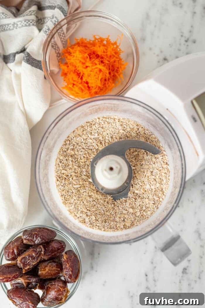 Spiced Carrot Cake Fuel Bites 4 Oats blended into a fine grainy consistency in a food processor.