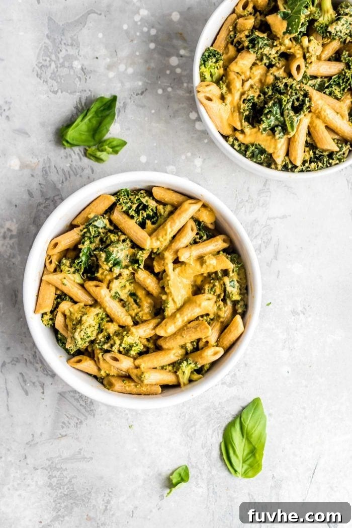Nutritional Yeast: Your Passport to Cheesy Flavor, Plant-Based Nutrition 5 Creamy Healthy Vegan Roasted Red Pepper Pesto Pasta with Kale and Broccoli - a bowl of pasta