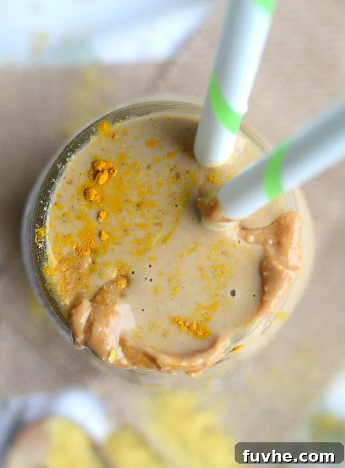 Nutritional Yeast: Your Passport to Cheesy Flavor, Plant-Based Nutrition 6 Vegan Peanut Butter Cup Protein Shake - a glass with a shake and flakes in a bowl