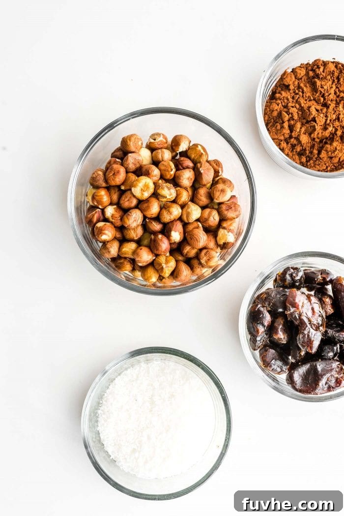 Ingredients for making raw vegan hazelnut truffles laid out on a clean surface.