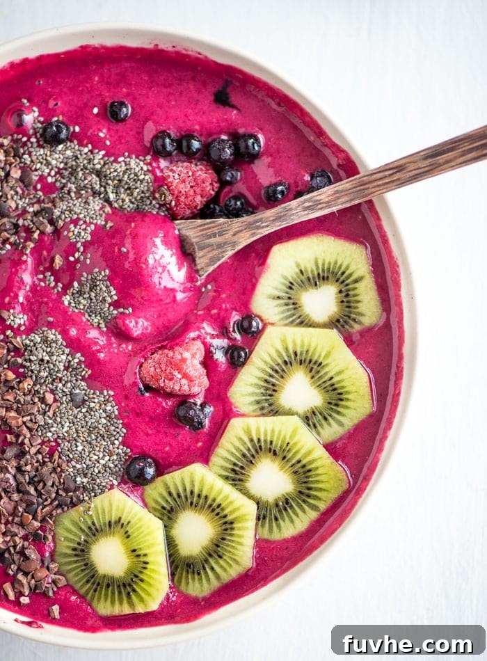 Vibrant Strawberry Beet Smoothie Bowl 4 Healthy Strawberry Beet Smoothie Bowl - A beautifully topped smoothie bowl, showcasing its vibrant color and various toppings.