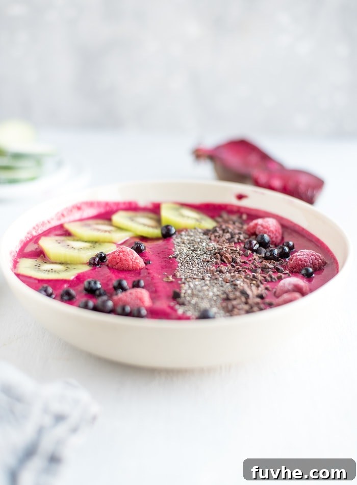 Vibrant Strawberry Beet Smoothie Bowl 5 Vegan Berry and Beet Smoothie Bowl - A close-up of a purple smoothie bowl with toppings, demonstrating appealing texture and color.