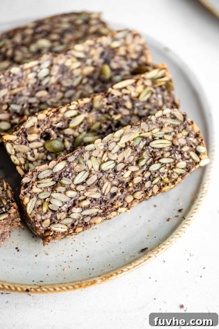 Slices of hearty seed loaf on a plate.
