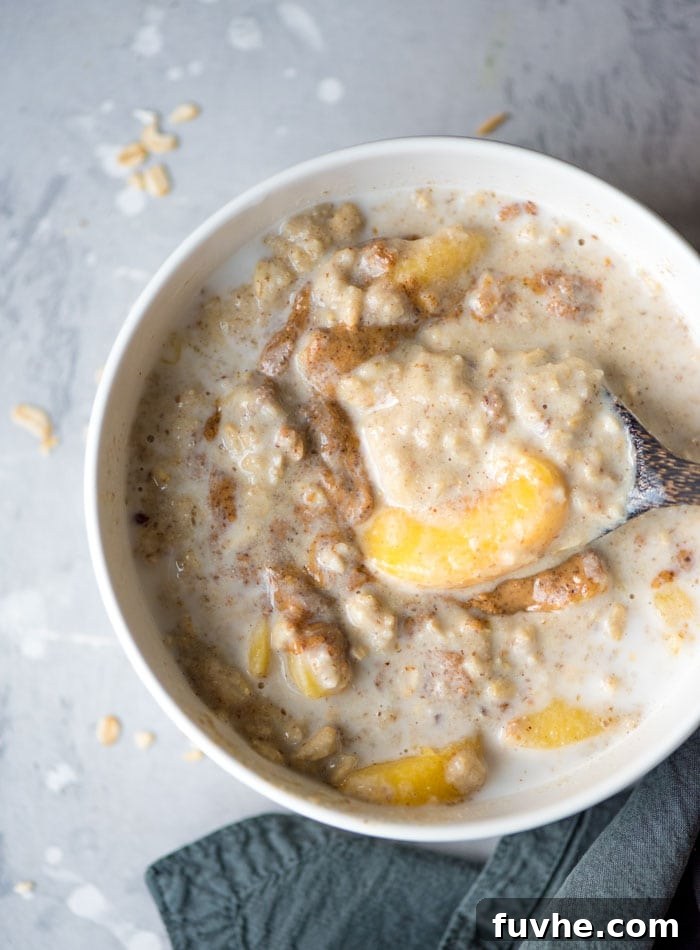 Vegan Peaches and Cream Oatmeal with Almond Butter and Flax Seeds