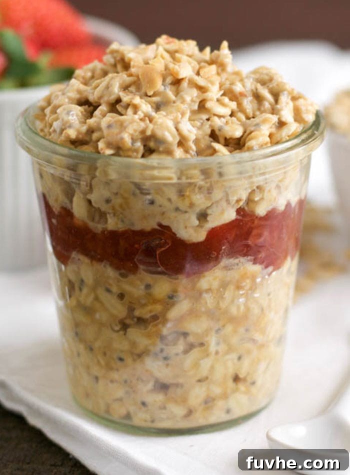 A jar of overnight oats with berries.