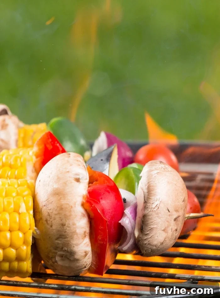 Plant-Based Campfire Cuisine 6 Delicious grilled veggie and tofu kabobs, perfectly charred and seasoned, making a healthy and customizable vegan camping dinner.