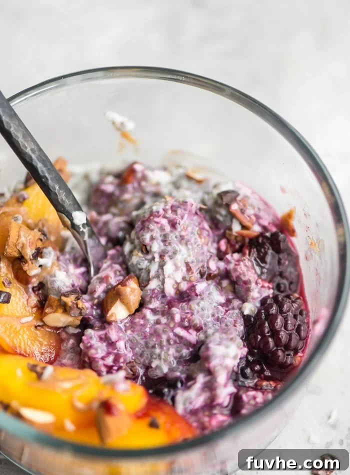 Tropical Chia Cloud 4 Chia and coconut pudding in a bowl with peaches and berries, showcasing a healthy and customizable breakfast.