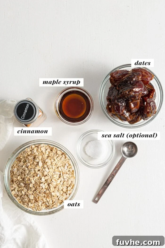 Warm Spice Energy Drops 3 Bowls of oats, dates, maple syrup, and cinnamon, representing the four core ingredients for the energy balls.
