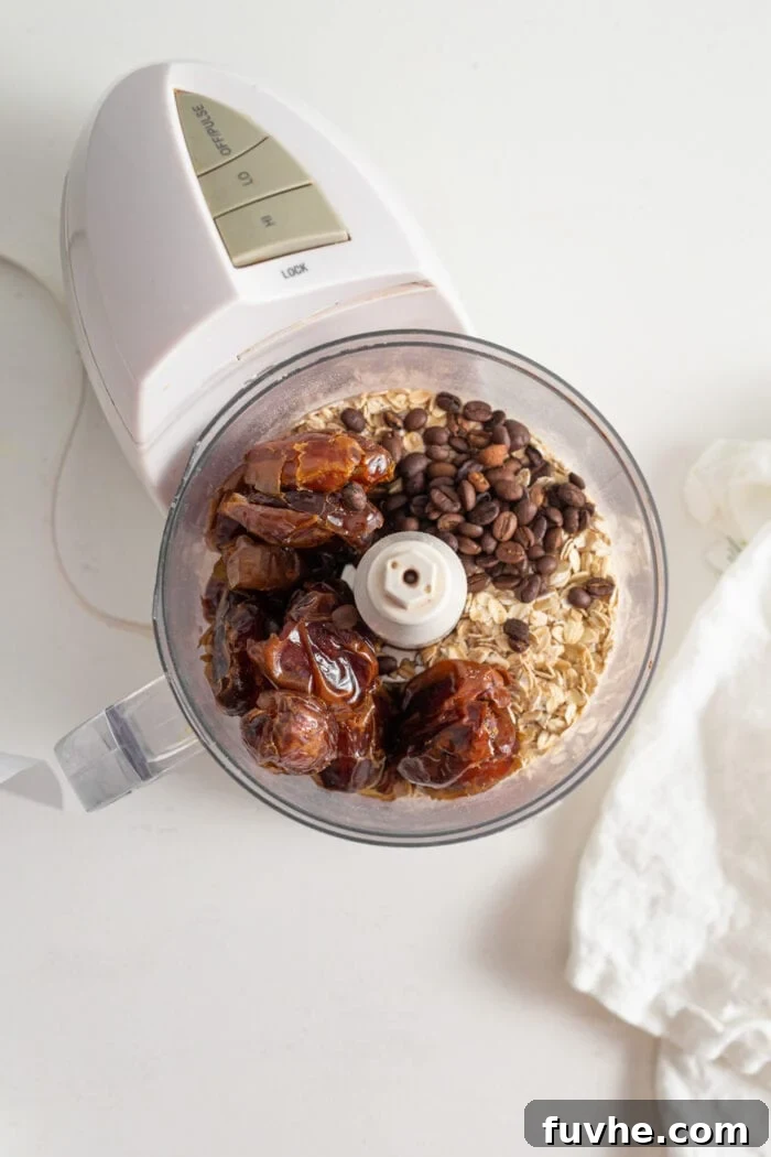 Coffee Fuel Bars 4 Dates, oats, coffee beans and vanilla in a food processor.
