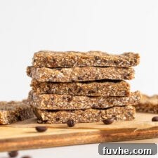 Coffee Fuel Bars 7 Stack of 4 energy bars on a cutting board. Coffee beans scattered around.