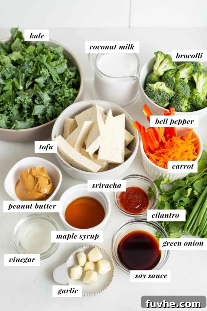 Labelled ingredients for a tofu kale broccoli salad with peanut sauce.