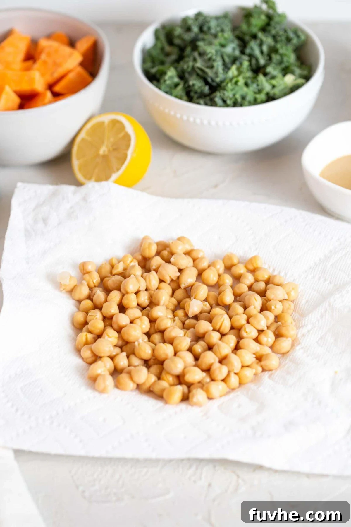 Crispy Roasted Chickpea Kale Salad 4 Cooked chickpeas sitting on paper towel, drying after being rinsed.