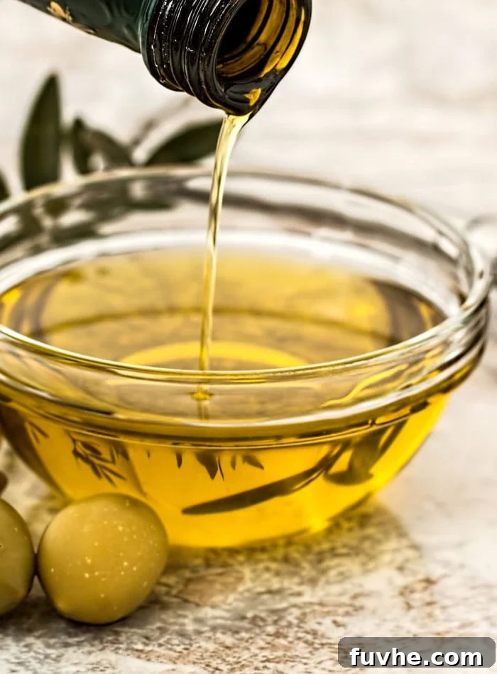 A selection of healthy cooking oils with high smoke points, emphasizing anti-inflammatory culinary choices.