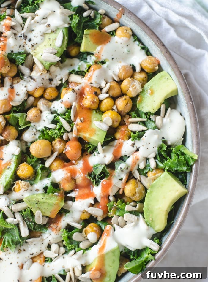 A colorful roasted chickpea kale salad with avocado and sweet potato, rich in anti-inflammatory micronutrients.