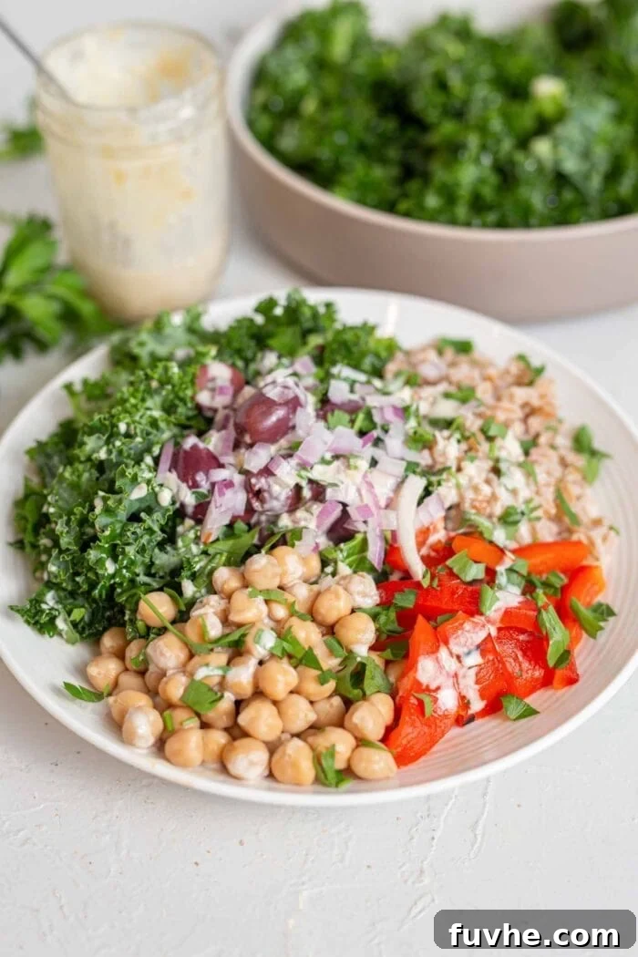 3-Day Plant-Based Whole Food Reset 5 A big bowl filled with chickpeas, farro, kale, roasted red peppers and red onion.