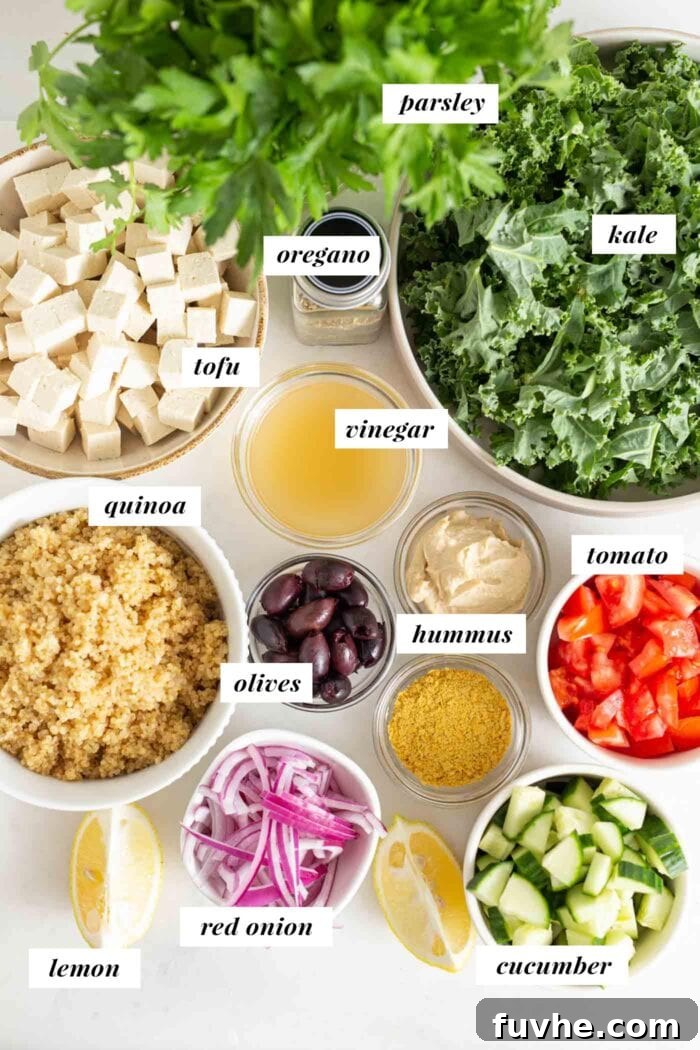 Vibrant Mediterranean Quinoa Bowls 3 A selection of fresh ingredients laid out for a Mediterranean quinoa salad bowl, including olives, hummus, and various chopped vegetables.