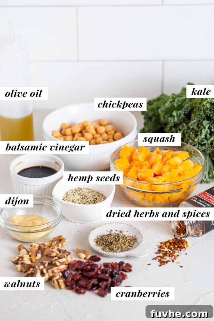 Golden Roasted Squash and Kale Medley 3 Squash, chickpeas, walnuts, hemp seeds, kale and herbs in containers on a counter.
