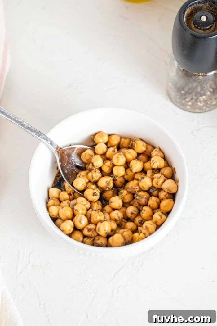 Golden Roasted Squash and Kale Medley 4 Marinated chickpeas in a small dish.