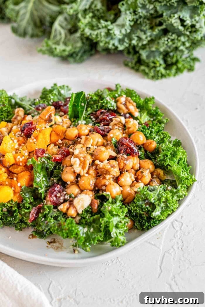 Golden Roasted Squash and Kale Medley 7 A squash, cranberry, walnut and chickpea kale salad in a bowl.