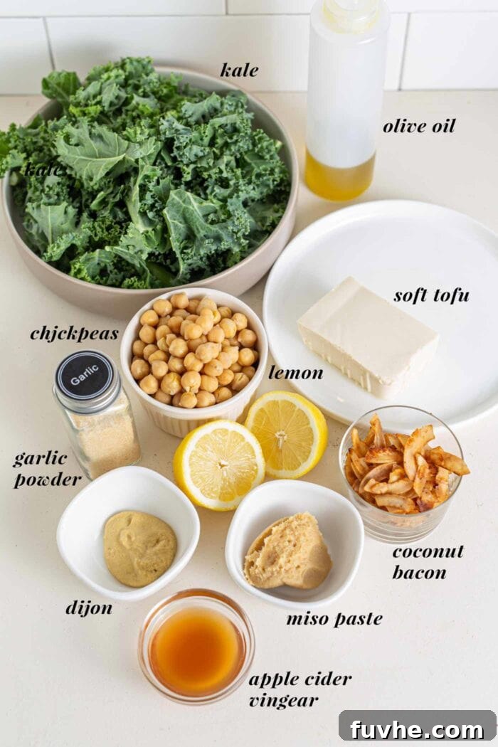 The Ultimate Vegan Kale Caesar 3 Labelled ingredients for a kale caesar salad on a counter top.