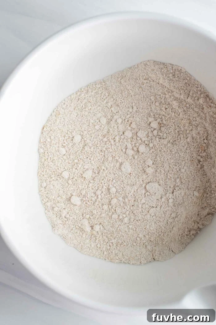 Finely ground oat flour in a large mixing bowl, ready for baking.