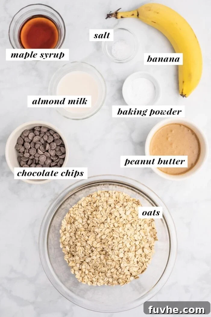 Irresistible Vegan Peanut Butter Oatmeal Cookies 3 A visual guide showing all essential ingredients neatly arranged for making peanut butter oatmeal chocolate chip cookies, including bananas, peanut butter, oats, and chocolate chips.