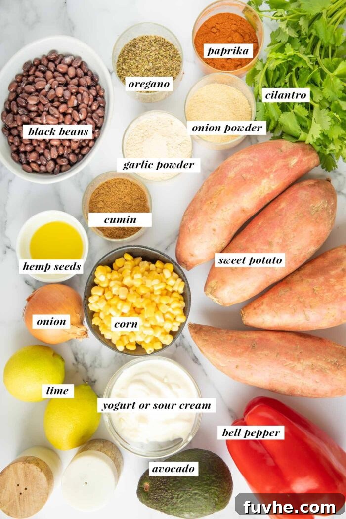 All the ingredients gathered for making a black bean and corn stuffed sweet potato topped with sour cream and avocado.
