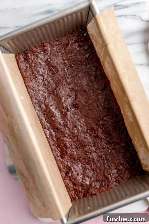 Effortless Chocolate Protein Treats 6 Chocolate bars in a lined loaf pan.