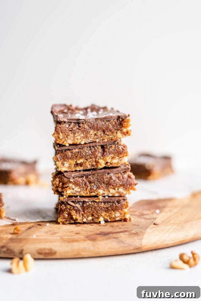 Sweet Swaps from Nature 2 A stack of 4 chocolate caramel bars on a cutting board.