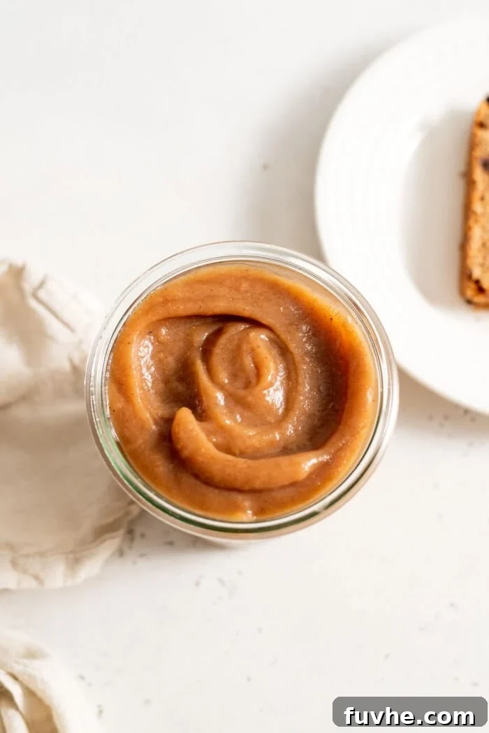 Sweet Swaps from Nature 7 Thick apple butter in a glass jar.