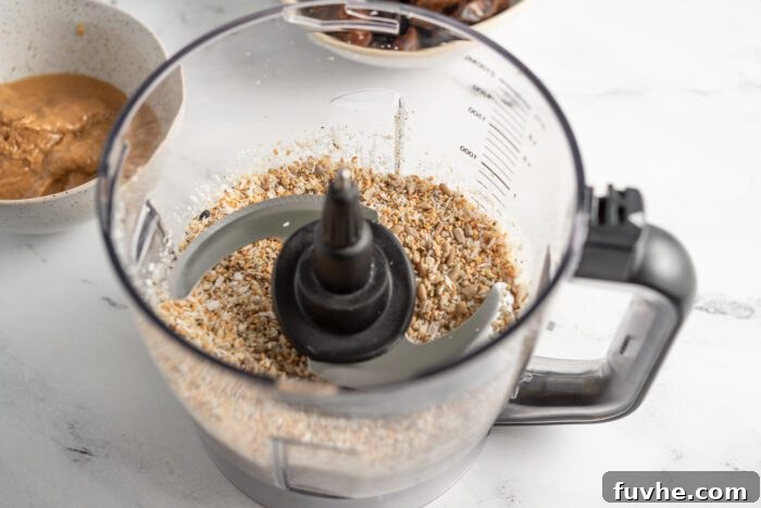 Blended sunflower seeds, coconut, hemp seeds and sesame seeds in a food processor, ready for the next step.