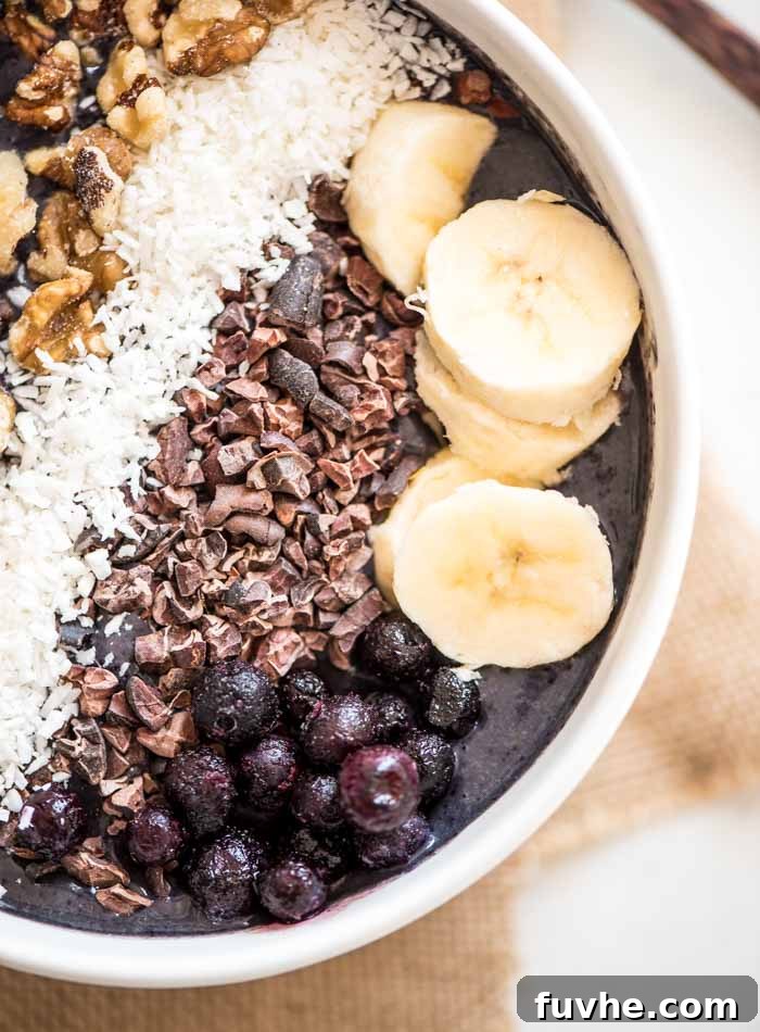 Delicious Vegan Banana Blueberry Smoothie topped with Fresh Spinach