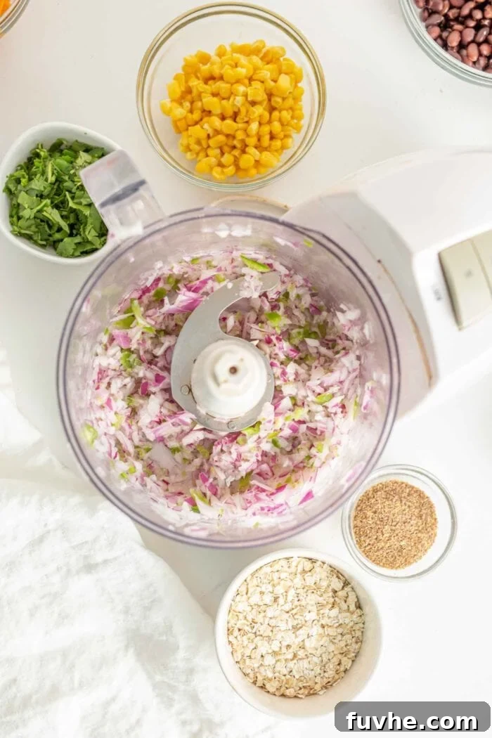 Chopped onions and jalapeno in a food processor.