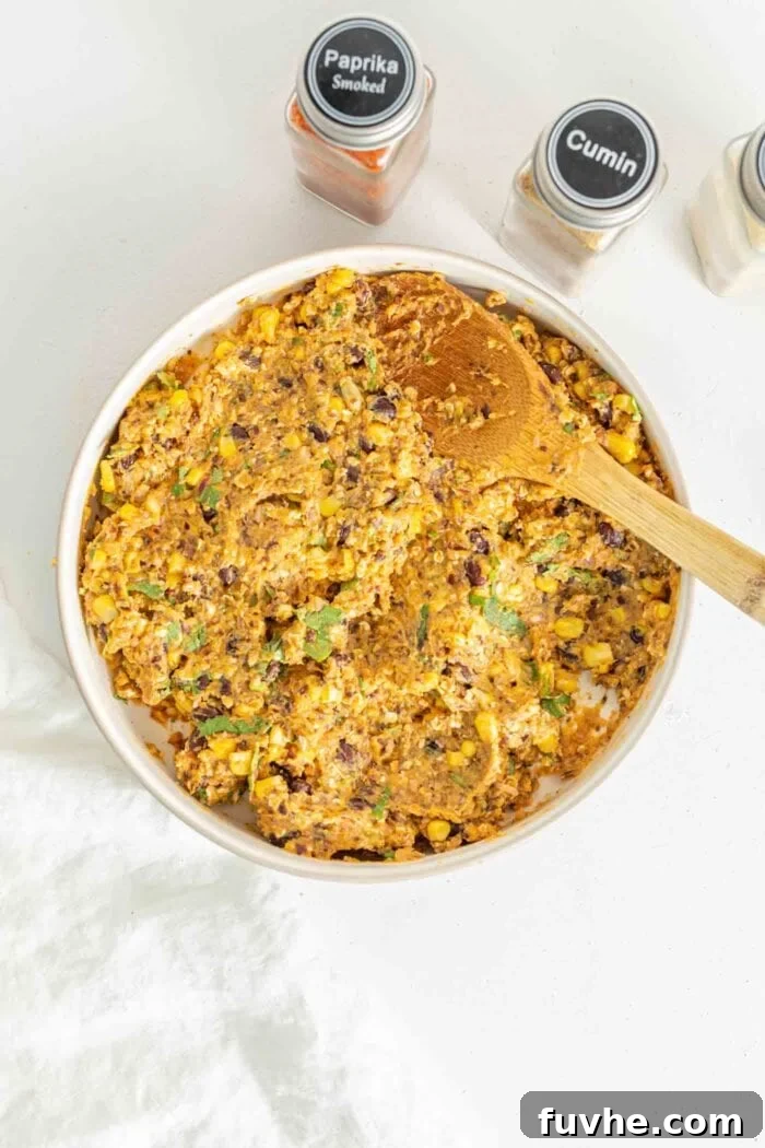 Raw sweet potato burger mixture in a bowl.