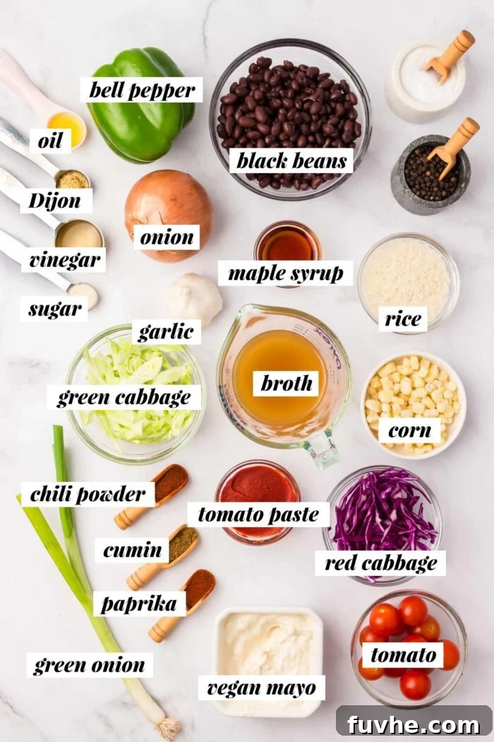 All of the fresh ingredients neatly arranged in bowls and measuring cups, ready to be transformed into a vibrant vegan BBQ black beans and rice bowl with creamy cabbage slaw and charred corn.