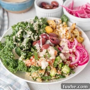 Mediterranean Cauliflower Power Bowls 8 Bowl with roasted cauliflower, olives, pickled red onion, kale and tahini.
