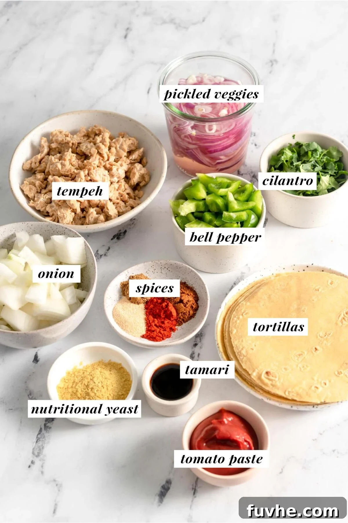 Savory Tempeh Tacos 3 All ingredients needed for making a vegan tempeh taco recipe, thoughtfully arranged and labelled.