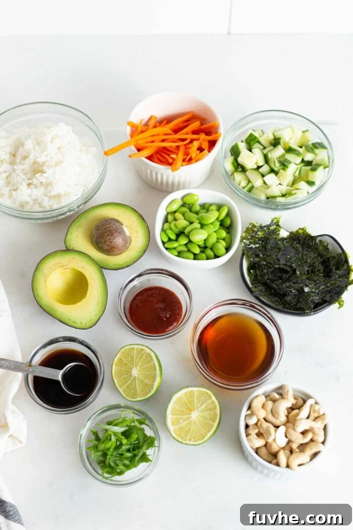 Various fresh ingredients for making vegan sushi bowls laid out in small dishes on a kitchen counter, including cooked rice, shelled edamame, and an assortment of vibrant vegetables.