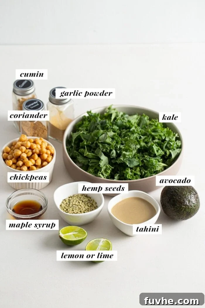 Visual of ingredients for a chickpea avocado kale salad labelled with text overlay. Includes tahini, lime, garlic powder, maple syrup, chickpeas, kale, avocado, and hemp seeds.