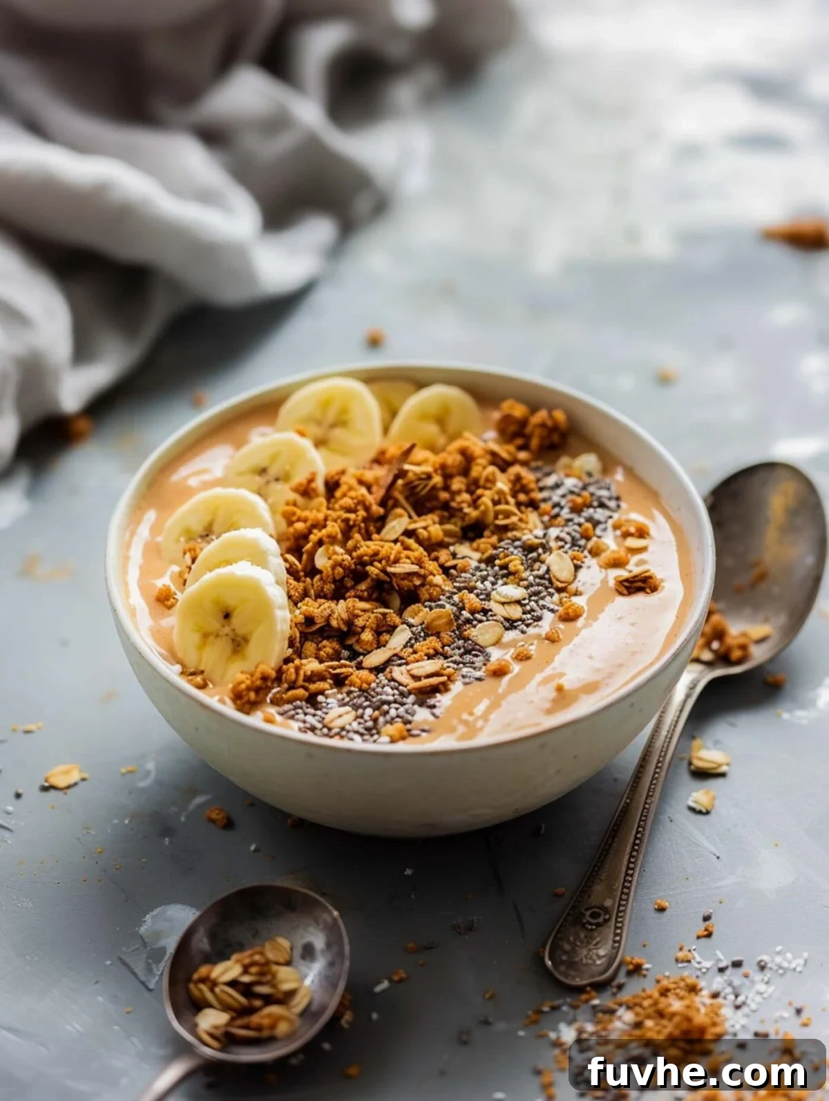Velvet Sweet Potato Sip 6 Sweet potato smoothie bowl topped with chia seeds, granola and banana.