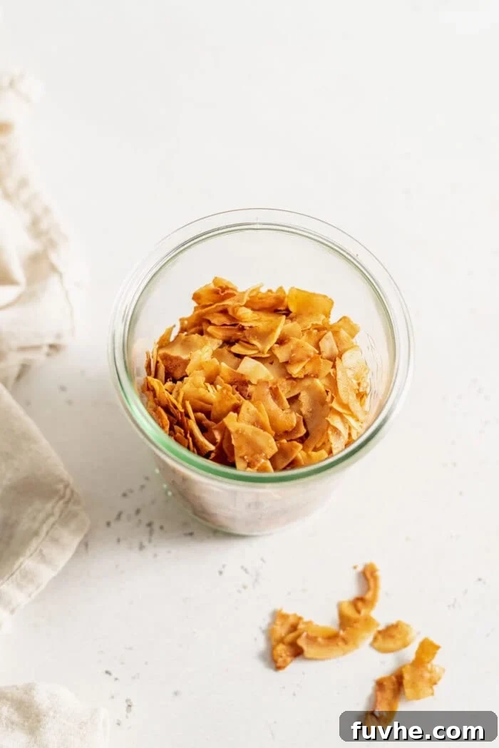 Smoky Coconut Crisps 8 Coconut bacon in a glass jar.