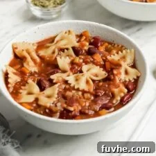 Bowl of minestrone soup with beans and pasta.