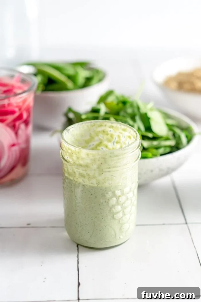 Creamy cilantro mint hemp seed dressing in a small jar.
