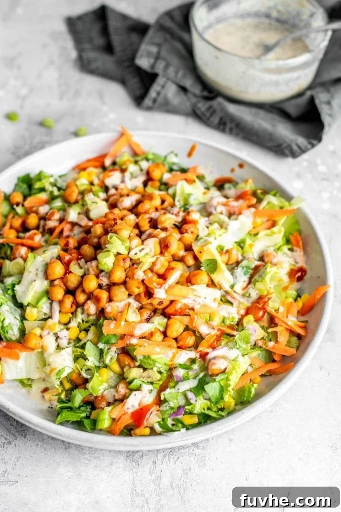 A vibrant, healthy vegan BBQ chickpea salad, full of color and fresh ingredients.