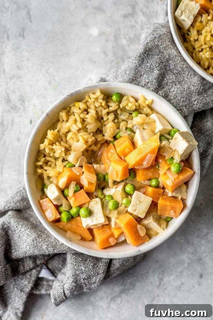 Small bowl of sweet potato curry with brown rice.