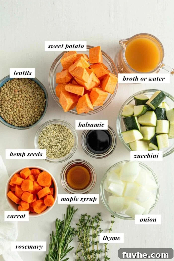 Labelled ingredients for making a roasted vegetable lentil salad, including fresh vegetables, herbs, and lentils.