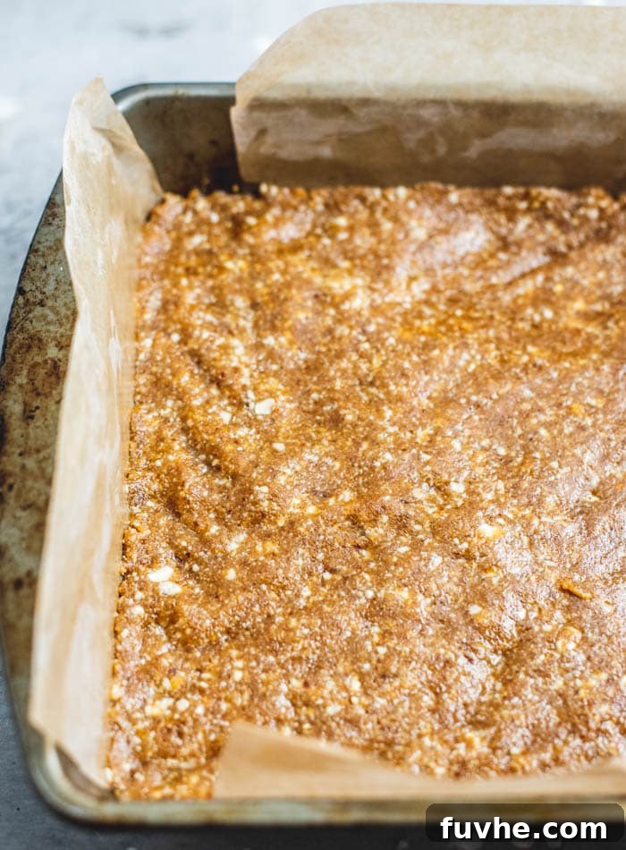 Wholesome Cashew Tahini Treats 6 An overhead shot highlighting the irresistible texture and composition of the vegan no-bake tahini cashew bars, with the glistening chocolate and sea salt topping.