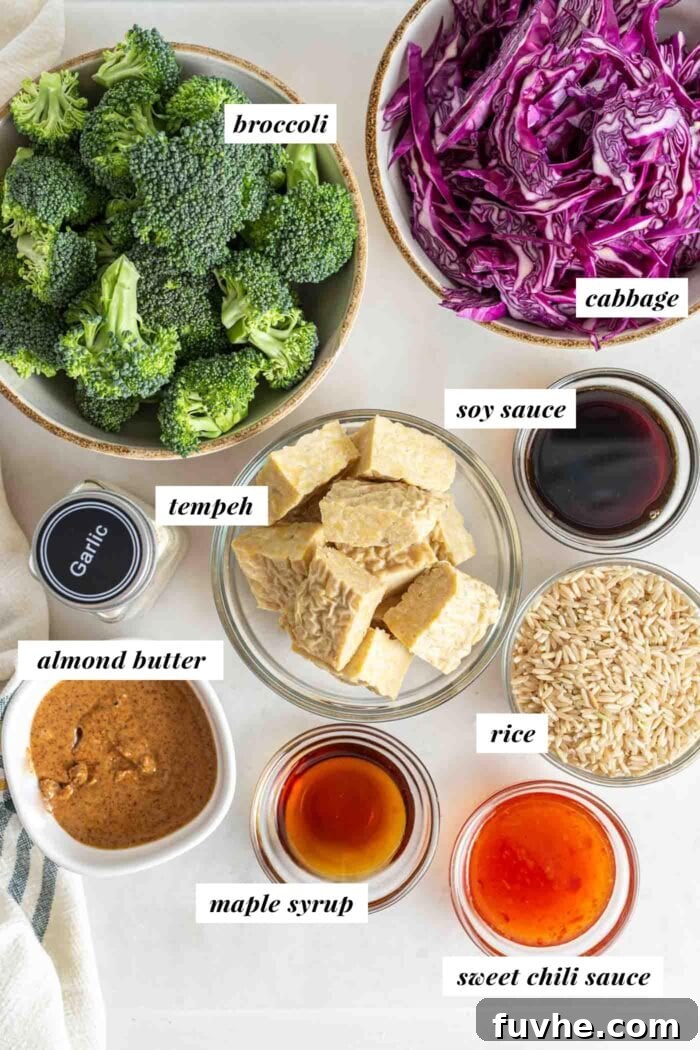 Labelled ingredients in bowls for making a tempeh brown rice bowl.
