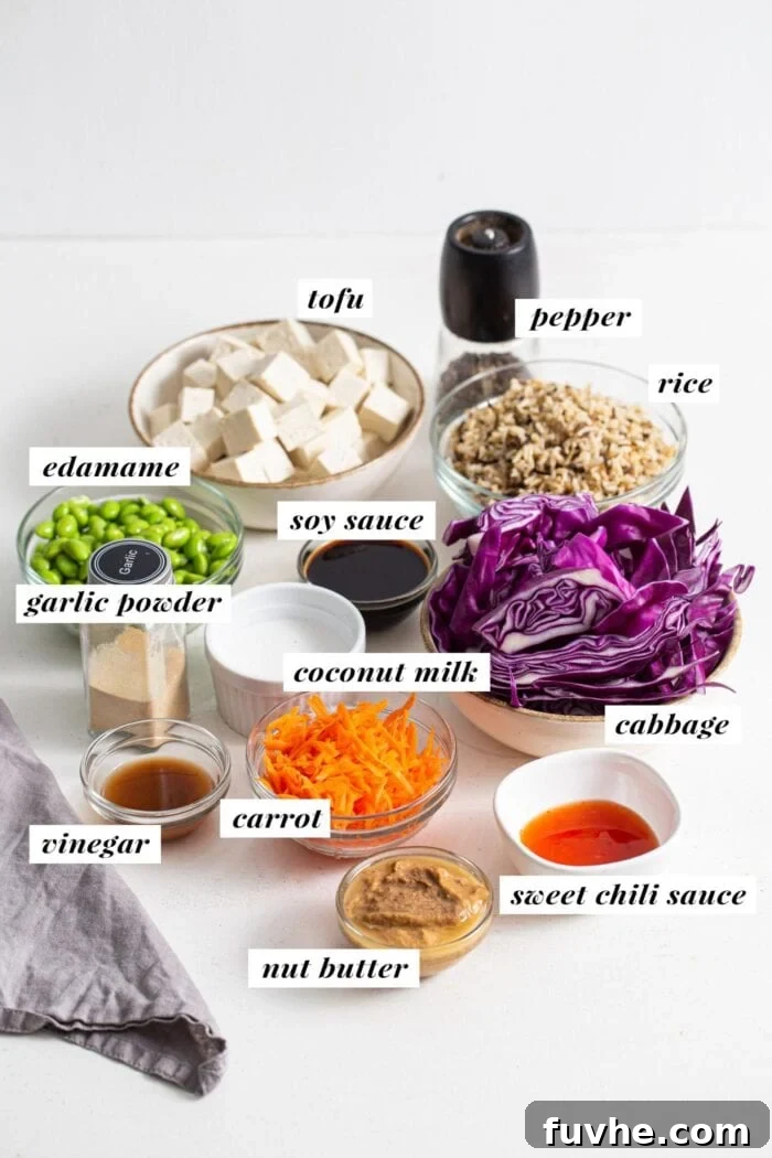 Labelled ingredients for making a tofu edamame buddha bowl.